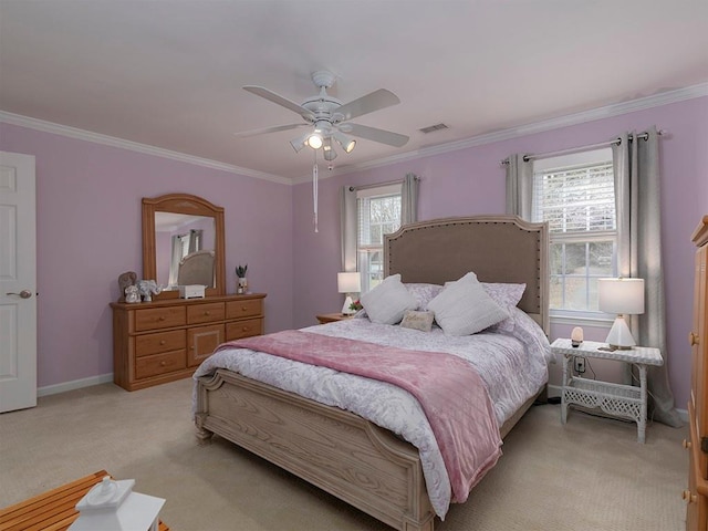 carpeted bedroom with crown molding, ceiling fan, and multiple windows