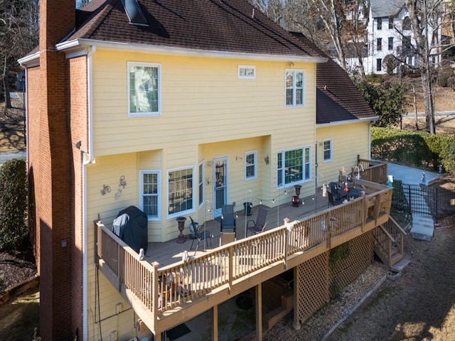 rear view of house with a deck