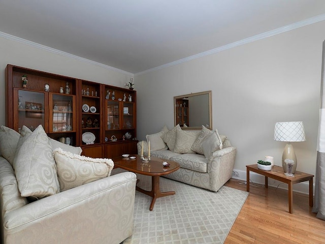 living room with hardwood / wood-style flooring and ornamental molding