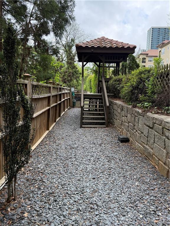 955 Juniper St Unit 3026, Atlanta, GA 30309 - view of yard featuring fence, a gazebo, and stairs