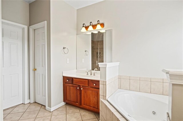 bathroom featuring vanity, separate shower and tub, and tile patterned floors