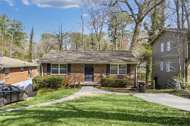 view of front of property with brick siding and a front lawn