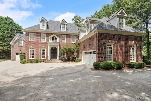 colonial inspired home with a garage