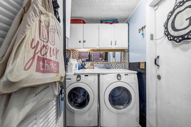 131 W Blue Branch Rd, Eatonton, GA 31024 - washroom with cabinet space, washer and clothes dryer, and a textured ceiling