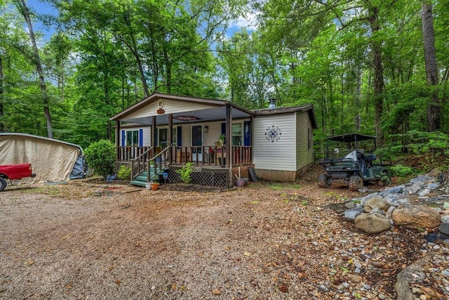 131 W Blue Branch Rd, Eatonton, GA 31024 - manufactured / mobile home with covered porch and a carport