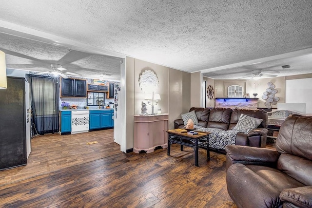 131 W Blue Branch Rd, Eatonton, GA 31024 - living area featuring a ceiling fan, dark wood finished floors, and a textured ceiling