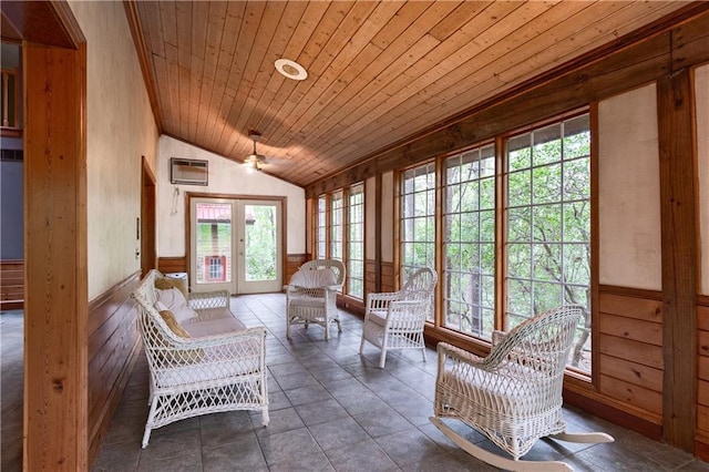 sunroom with french doors, a healthy amount of sunlight, a wall unit AC, vaulted ceiling, and wood ceiling