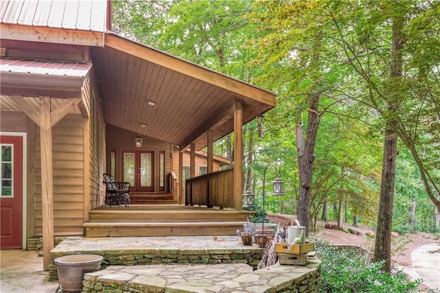 doorway to property featuring french doors and a porch