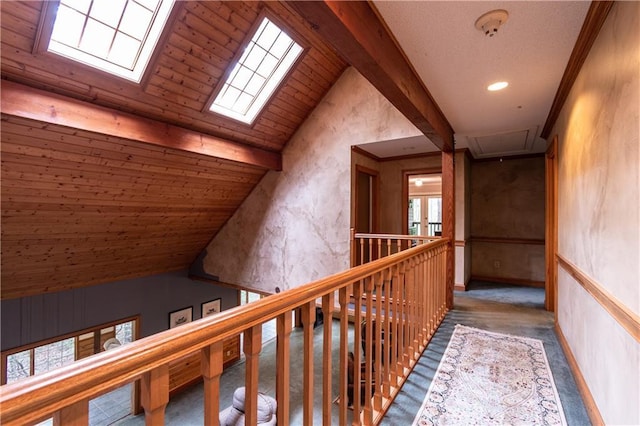 hall with lofted ceiling with skylight and wood ceiling