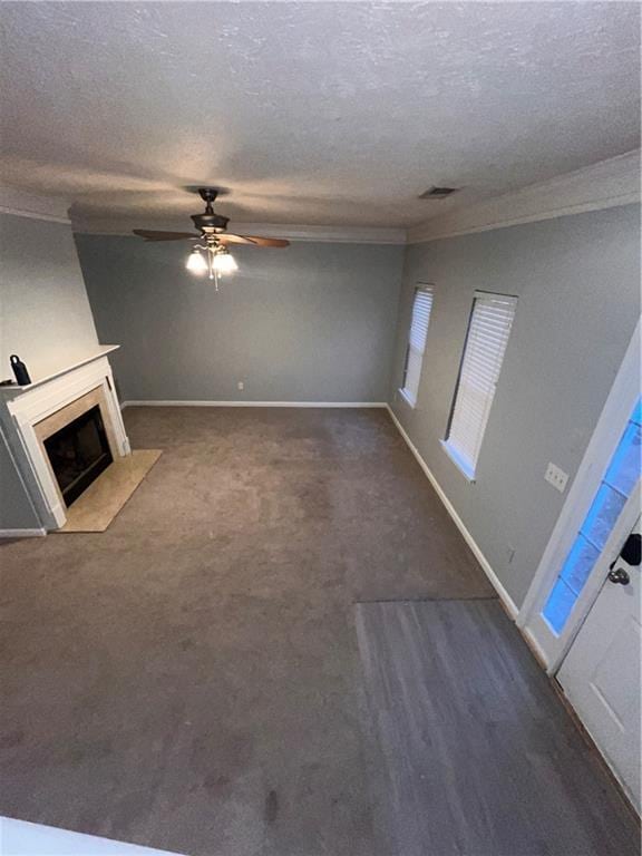 142 Benfield Cir, Cartersville, GA 30121 - unfurnished living room featuring a textured ceiling, ceiling fan, ornamental molding, and a fireplace