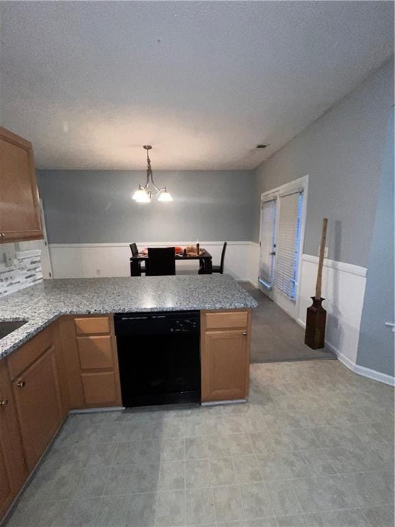 142 Benfield Cir, Cartersville, GA 30121 - kitchen with decorative light fixtures, kitchen peninsula, sink, an inviting chandelier, and black dishwasher