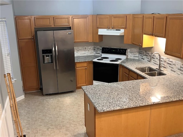 142 Benfield Cir, Cartersville, GA 30121 - kitchen with range with electric stovetop, stainless steel fridge, decorative backsplash, light stone counters, and sink