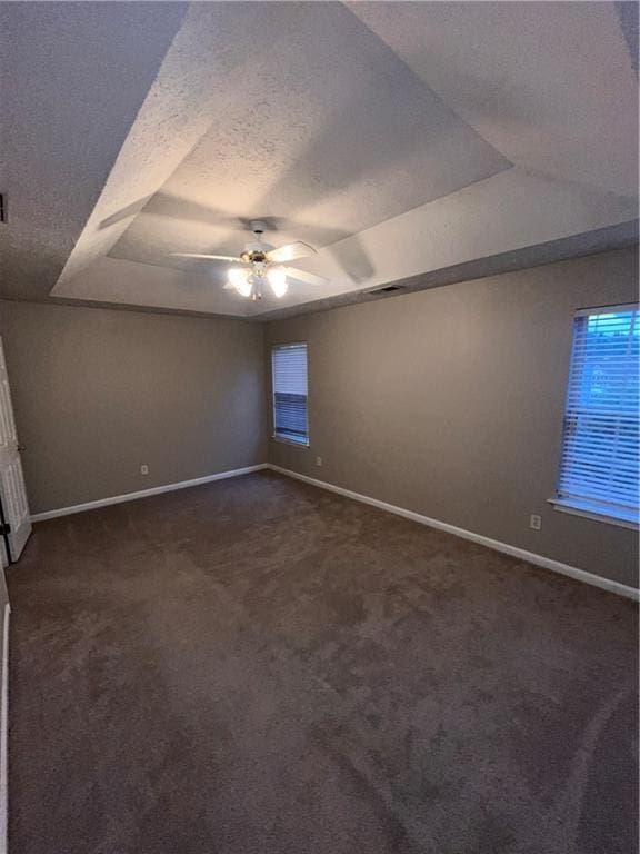 142 Benfield Cir, Cartersville, GA 30121 - carpeted spare room with a textured ceiling, ceiling fan, and a tray ceiling