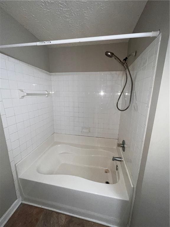 142 Benfield Cir, Cartersville, GA 30121 - bathroom featuring a textured ceiling and bathtub / shower combination