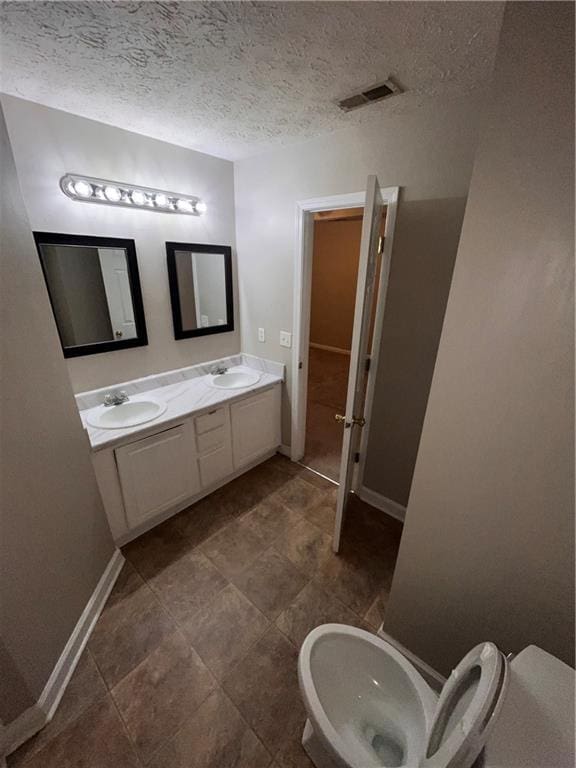 142 Benfield Cir, Cartersville, GA 30121 - bathroom with a textured ceiling and vanity