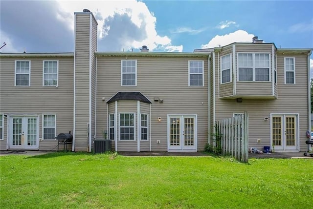 142 Benfield Cir, Cartersville, GA 30121 - back of house with central air condition unit, french doors, and a yard