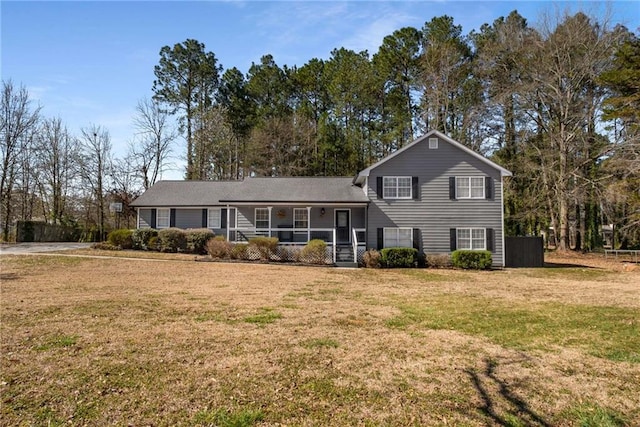 tri-level home with a front yard