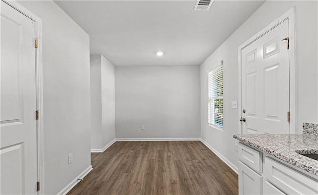 foyer entrance with dark wood-type flooring