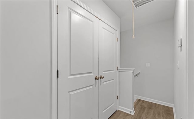 corridor featuring light hardwood / wood-style floors