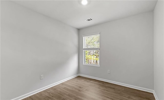 spare room featuring hardwood / wood-style flooring