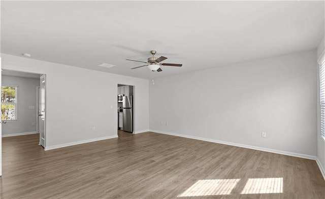 empty room featuring ceiling fan and wood-type flooring