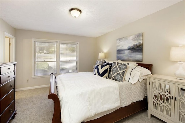 carpeted bedroom with baseboards