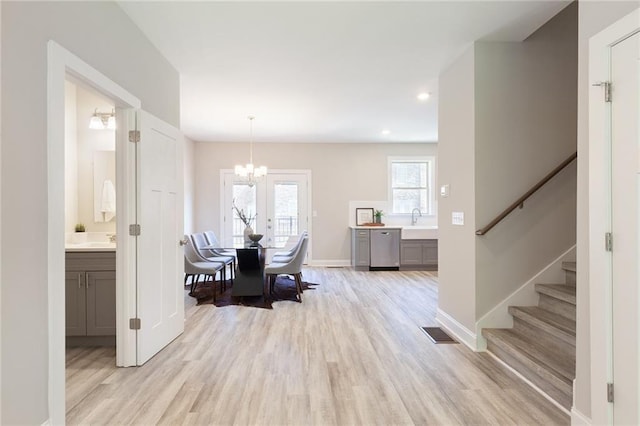 3810 Jack Vernon Cir, Powder Springs, GA 30127 - dining space featuring a chandelier, light wood finished floors, stairs, baseboards, and recessed lighting