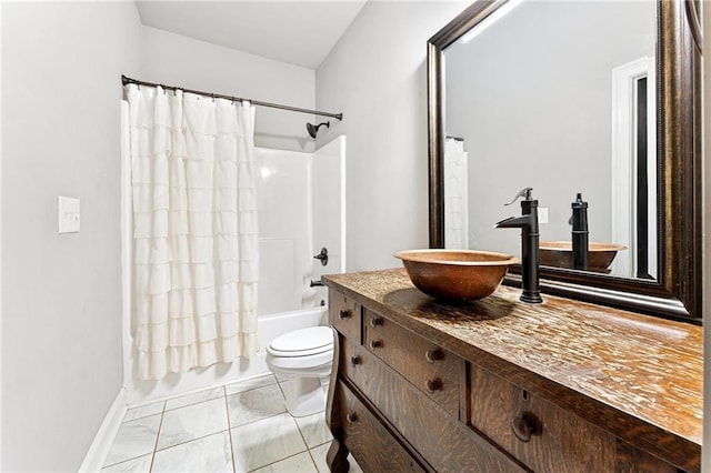 bathroom with vanity, tile patterned floors, toilet, and shower / tub combo with curtain