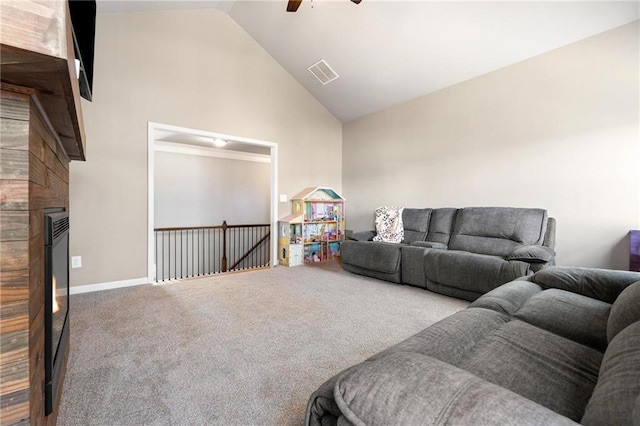 living area with visible vents, baseboards, carpet floors, high vaulted ceiling, and a ceiling fan