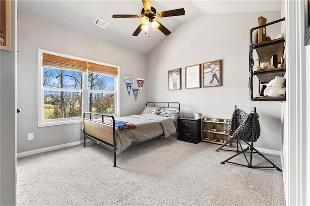 bedroom featuring a ceiling fan, carpet, visible vents, baseboards, and lofted ceiling