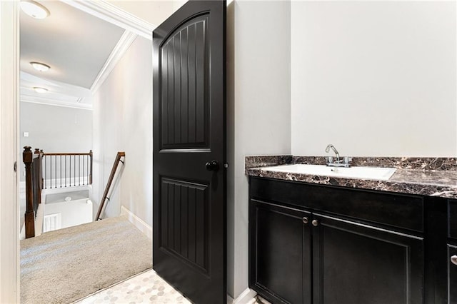 bathroom with vanity and crown molding