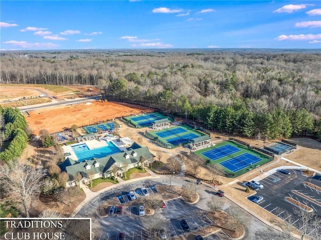 birds eye view of property with a wooded view