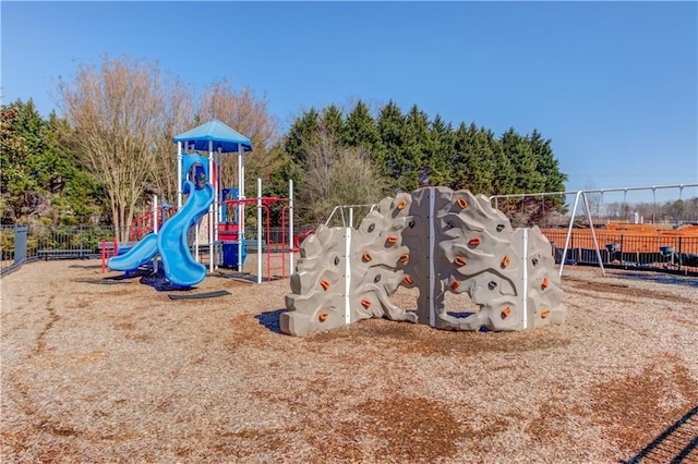 community jungle gym featuring fence