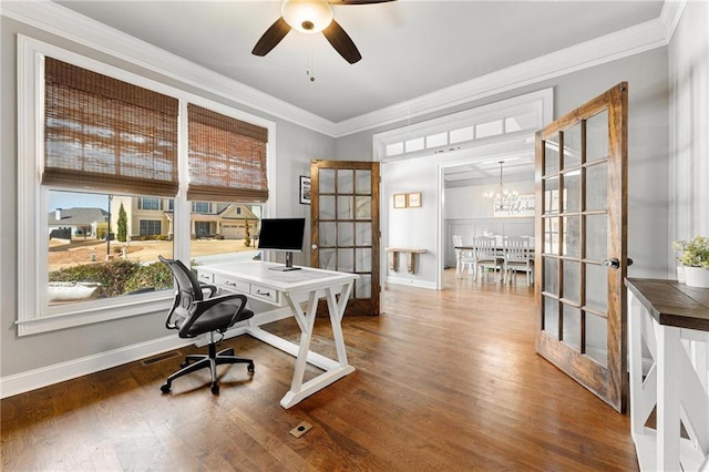 office space with french doors, crown molding, baseboards, and wood finished floors