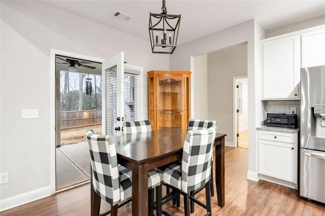 kitchen with visible vents, stainless steel appliances, a sink, and light wood-style flooring