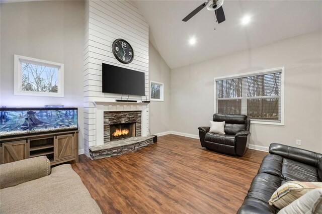 dining space featuring ceiling fan with notable chandelier, visible vents, baseboards, and wood finished floors