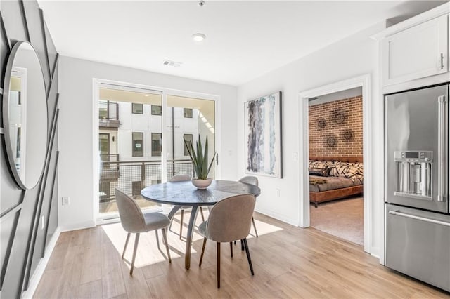 dining room featuring light hardwood / wood-style floors