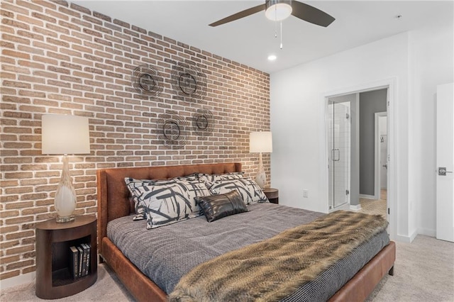 bedroom featuring ceiling fan, light colored carpet, and brick wall