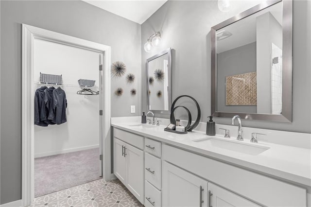 bathroom with tile patterned floors and vanity