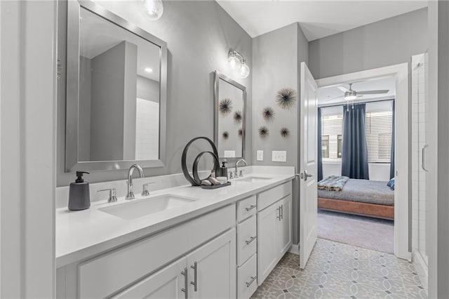 bathroom with tile patterned flooring, vanity, and ceiling fan