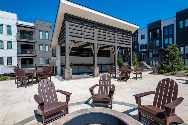 view of patio / terrace with a fire pit