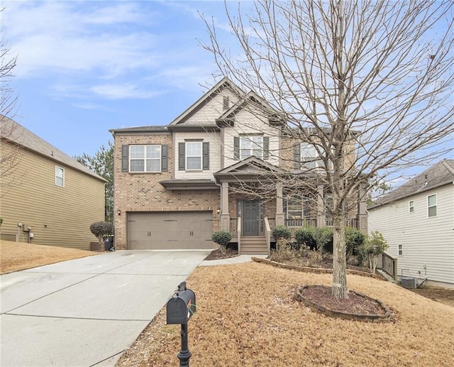 craftsman-style home with central AC and a garage