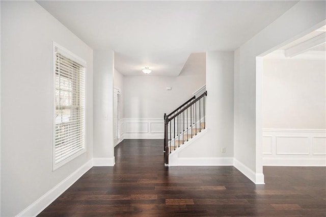 empty room with dark wood-type flooring