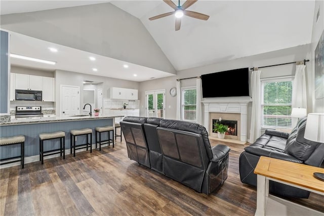 58 Hampton Forest Ct, Dahlonega, GA 30533 - living room featuring ceiling fan, dark wood-style floors, high vaulted ceiling, plenty of natural light, and a fireplace with flush hearth