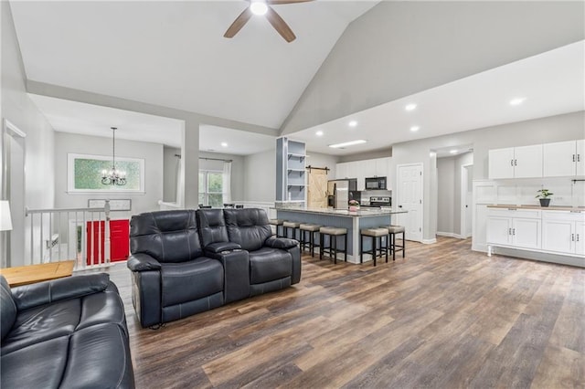 58 Hampton Forest Ct, Dahlonega, GA 30533 - living area with ceiling fan, a chandelier, dark wood-style flooring, high vaulted ceiling, and recessed lighting