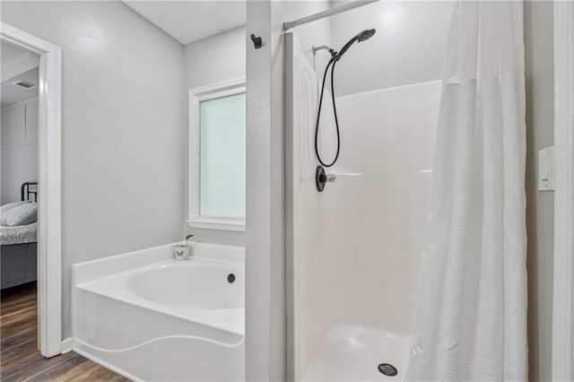 58 Hampton Forest Ct, Dahlonega, GA 30533 - bathroom with a shower stall, a garden tub, and wood finished floors