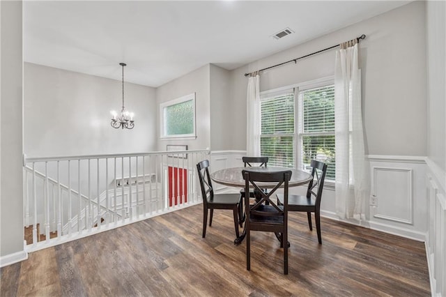 58 Hampton Forest Ct, Dahlonega, GA 30533 - dining space with wood finished floors, a wainscoted wall, a chandelier, and a decorative wall