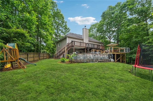 58 Hampton Forest Ct, Dahlonega, GA 30533 - view of yard with a trampoline, stairs, a deck, and a playground