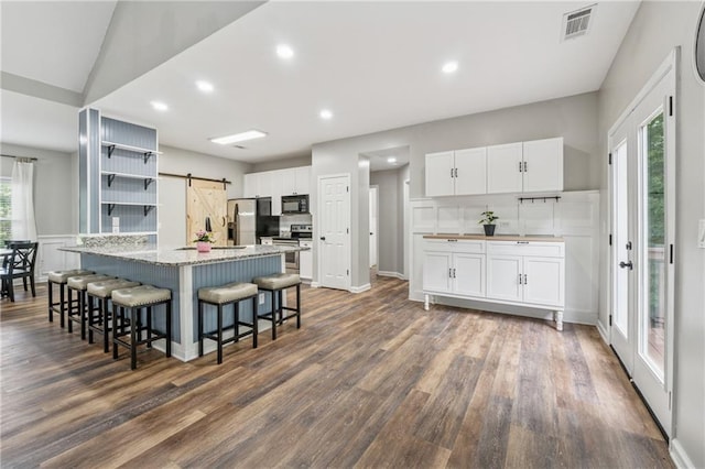 58 Hampton Forest Ct, Dahlonega, GA 30533 - kitchen with a barn door, appliances with stainless steel finishes, open shelves, white cabinetry, and recessed lighting