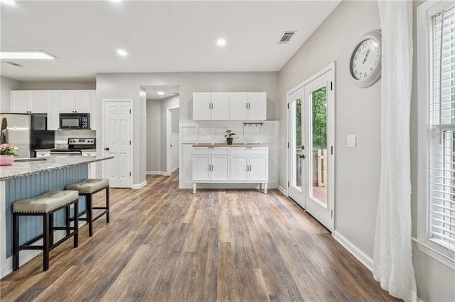 58 Hampton Forest Ct, Dahlonega, GA 30533 - kitchen with appliances with stainless steel finishes, dark wood-type flooring, white cabinets, baseboards, and recessed lighting